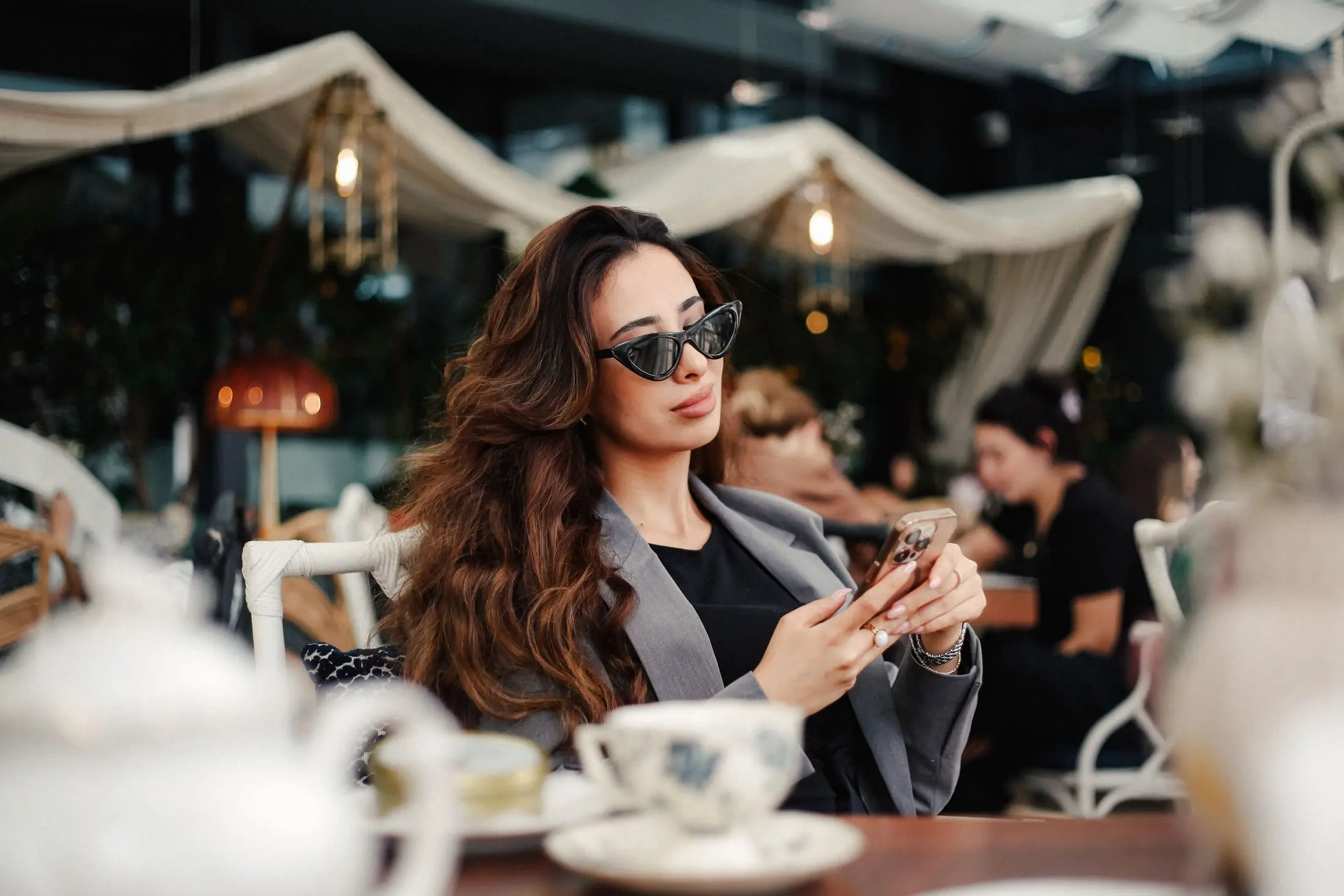 Person using a phone in a cafe
