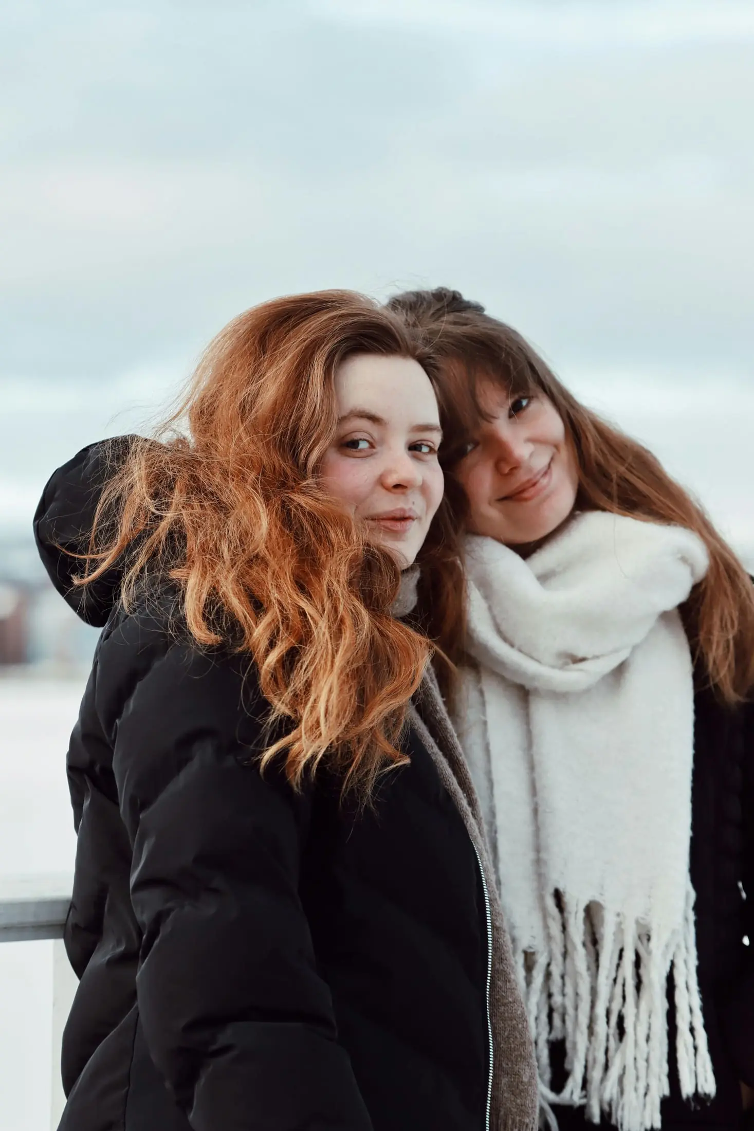 Two friends outdoors in cold weather